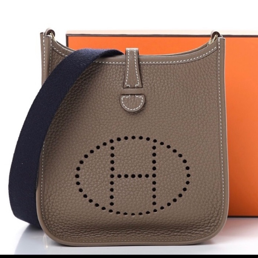 Hermès TPM Evelyn etoupe with navy straps .